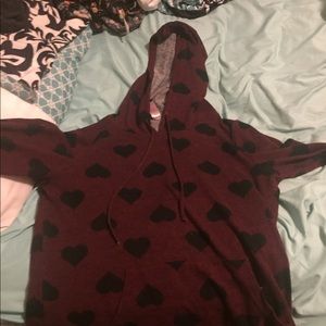 A long sleeved warm shirt with pockets and hood